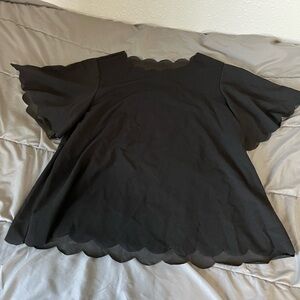 Scalloped black blouse